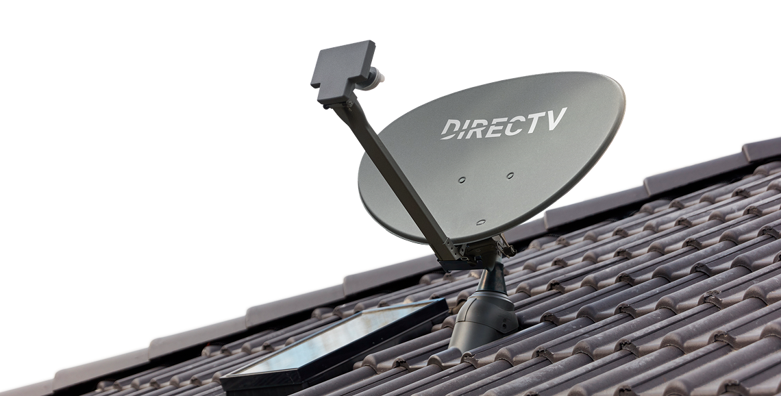 DIRECTV satellite dish mounted on a rooftop under a clear sky.