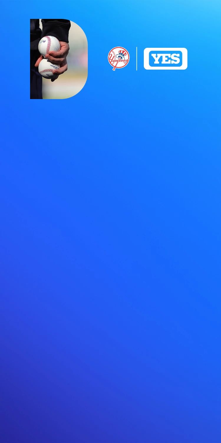 Close-up of baseballs held in hand representing NY Yankees coverage