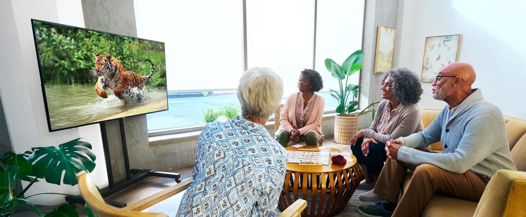  Directv seniors watching TV in community room
