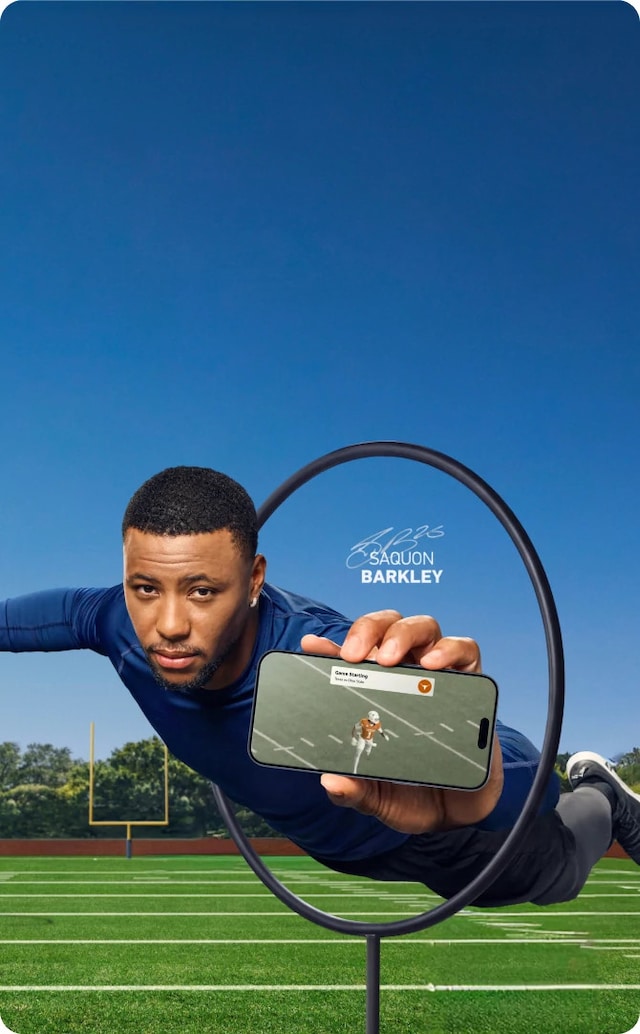 Saquon Barkley is jumping through a training hoop on a football field setting while holding a smart phone playing a Texas college football game through the DIRECTV App